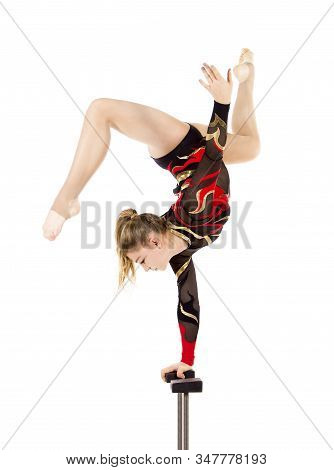 Beautiful Equilibrist In A Red And Black Suit, Performs Exercises On Acrobatic Canes.