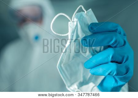 Epidemiologist Offering Protective Respiratory Mask In Coronavirus Concept, Selective Focus