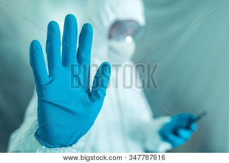 Epidemiologist Gesturing Stop Hand Sign In Coronavirus Concept, Selective Focus On Hand