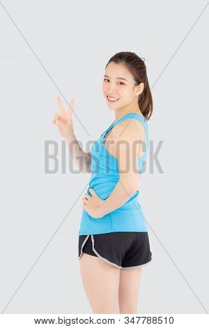 Beautiful Portrait Young Asian Woman In Sport Clothes With Satisfied And Confident Gesture Finger V 