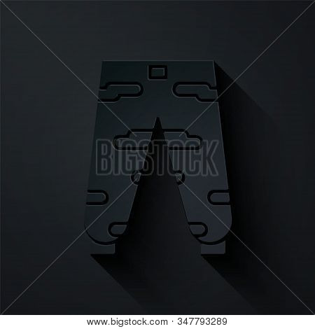 Paper Cut Camouflage Cargo Pants Icon Isolated On Black Background. Paper Art Style. Vector Illustra