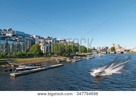 Saint-petersburg, Russia - May 30, 2019: A Man Is Sailing In A Boat On The Little Nevka River Near R
