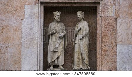 King Solomon And Queen Sheba, Statues From 12th-13th Century On A Facade Of The Baptistery In Parma,