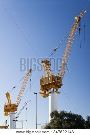 Yellow Cranes In The Shipyard For Ships Construction In Vigo, Pontevedra, Spain