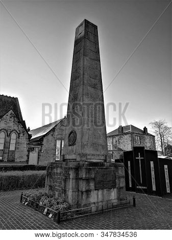 A View Of A War Memorial Monumental Obelisk In The West Lothian Town Of Bathgate In Scotland.