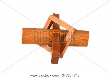 Wooden Cross Puzzle Isolated On A White Background.