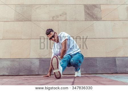 Male Dancer Young Guy, In Summer In The City, Dancing Street Dances, Modern Youth Style. Fashion And