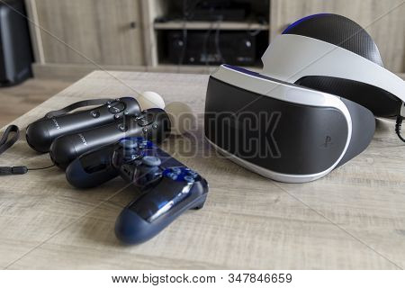 Brecht, Belgium - June 12 2019; A Playstation 4 Vr Headset Together With A Playstation 4 Controller 