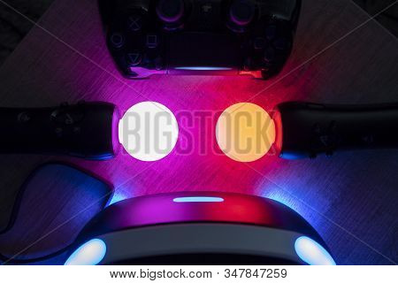 Brecht, Belgium - June 12 2019: A Dark Close Up Of A Turned On Playstation Vr Headset Together With 