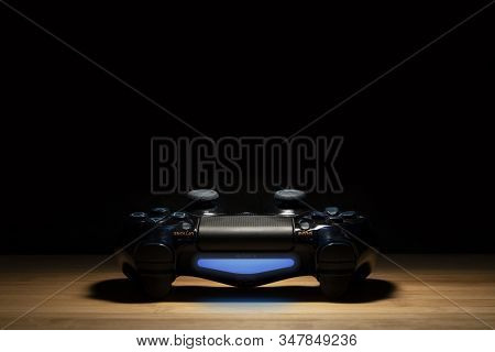 Brecht, Belgium - August 10 2019: A Portrait Of A Turned On Sony Playstation 4 Controller In The Spo