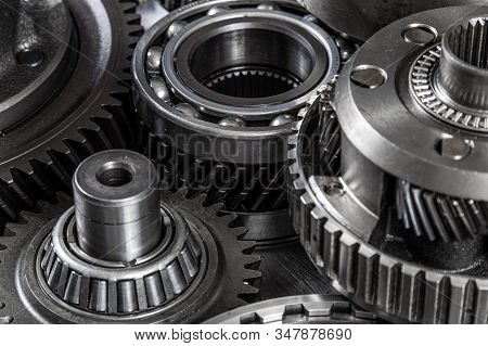 Close-up Of A Car Gearbox. Metallic Shiny Gears For Planetary Gearshift. Industrial Metal Gears For 