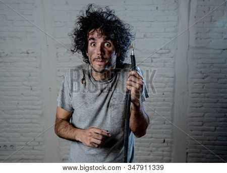 Funny Image Of Man Holding Electrical Cable After Getting Electric Shock