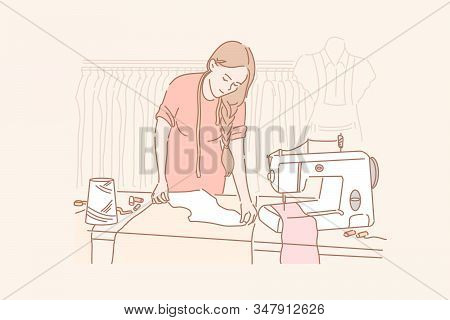 Tailor, Dressmaking, Sewing Concept. Young Woman Is Sewing Clothes In Her Clothing Store. Dressmakin