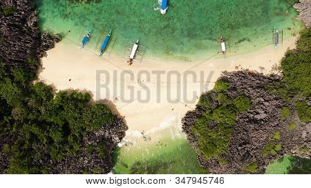 Beautiful Tropical Beach With Tourists And Boats, Aerial Drone. Lahos Island, Caramoan Islands, Phil