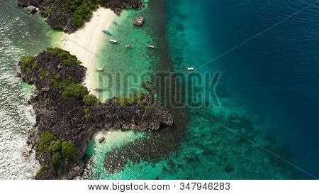 Tropical Beach With Tourists Surrounded By Blue Water, Aerial View. Lahos Island, Caramoan Islands, 