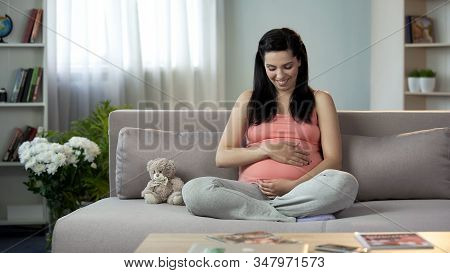 Full Of Maternal Instincts Woman Gently Touching Her Beloved Pregnant Tummy