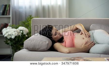 Nervous Pregnant Woman Touching Her Tummy, Worried About Future Baby, Healthcare
