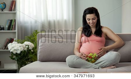Pregnant Woman Holding Fresh Salad, Accustoming Future Child To Healthy Food