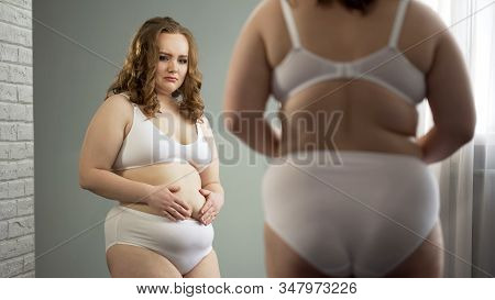 Depressed Oversize Woman In Underwear Looking In Mirror, Overweight Problem