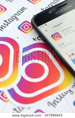 Instagram App On Samsung Smartphone Screen On Banner With Small Instagram Logos. Instagram Is Americ