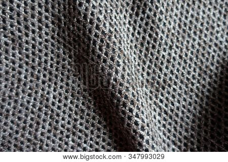 Folded Greyish Brown Woolen Fabric With Diamond Pattern