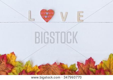 Love Day Concept. The Wooden Text Remain To Valentine's Day With Maple Leaf And White Background.val
