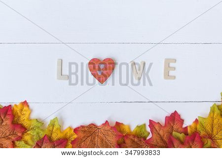 Love Day Concept. The Wooden Text Remain To Valentine's Day With Maple Leaf And White Background.val