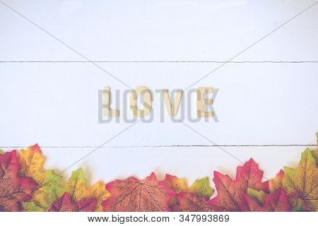 Love Day Concept. The Wooden Text Remain To Valentine's Day With Maple Leaf And White Background.val