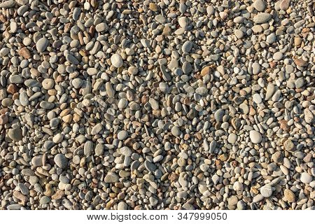 Nice Background Image Of Pebbles On A Beach. Wall Pattern Of Gravel Stone.