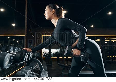 Female Athlete Performing Standing Single-arm Bent-over Row
