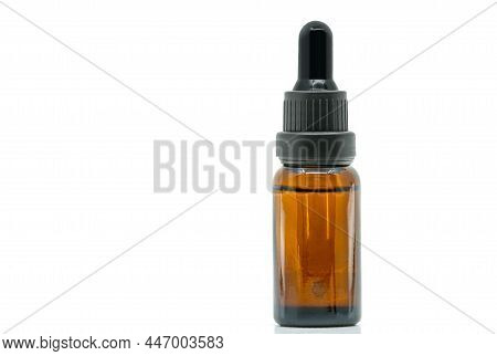 Close-up Image Of Brown Glass Bottle Dropper Bottle. Isolated Dropper Bottle On White Background. Bl