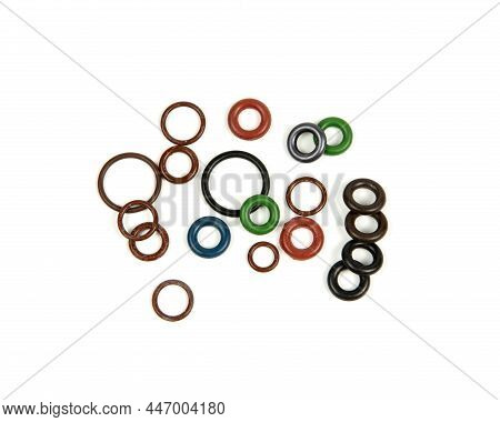 Hydraulic And Pneumatic O-rings In Different Sizes And Colors, On A White Background. Various Seals 
