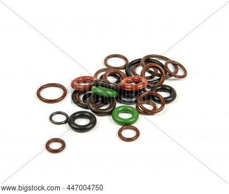Hydraulic And Pneumatic O-rings In Different Sizes And Colors, On A White Background. Various Seals 