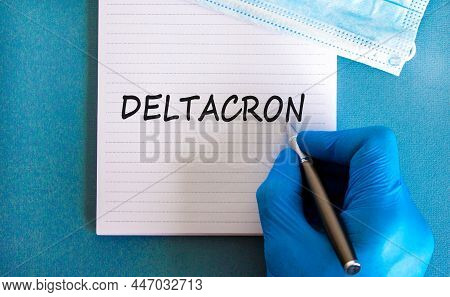 New Covid-19 Deltacron Variant Strain Symbol. Hand In Blue Glove, White Note. The Concept Word Delta