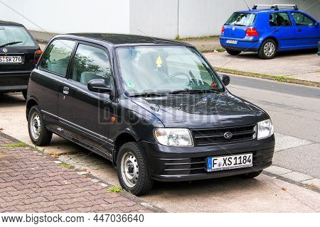 Frankfurt Am Main, Germany - September 15, 2013: Black Minicar Daihatsu Cuore (l700) In A City Stree