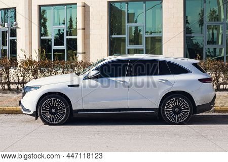 Side, Turkey -january 19, 2022: White Mercedes - Benz Eqc   Is Parked  On The Street On A Warm Summe