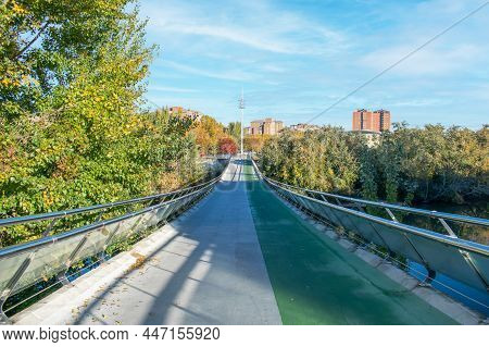 Pedestrian Bridge With Pedro Gomez Bike Lane Over The Pisuerga River As It Passes Through The City O