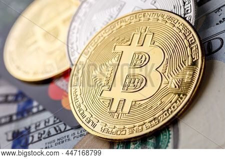 Golden Bitcoin Lies On The Banknotes.new Virtual Money. Crypto Currency Top View. Real Coins Of Bitc