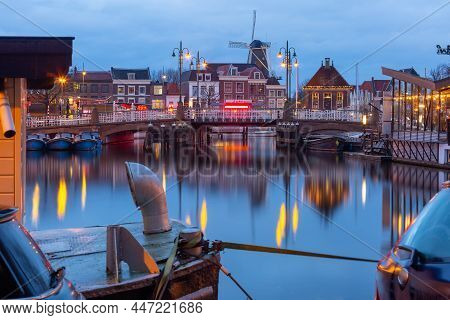 Night Leiden Canal With Blauwpoortsbrug Bridge And Windmill De Valk, South Holland, Netherlands.