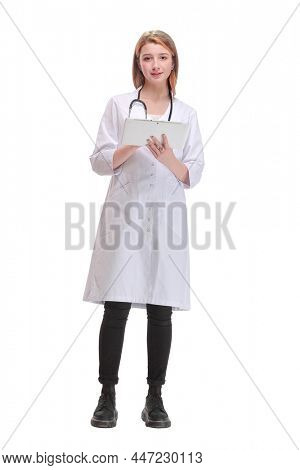 Full lenth portrait of a happy young doctor working with a tablet