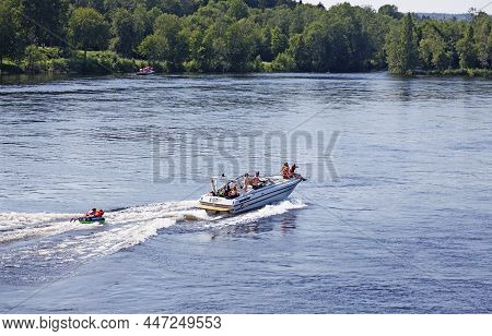 Umea, Norrland Sweden - July 26, 2020: Fast Motorboat With The Following Rubber Raft