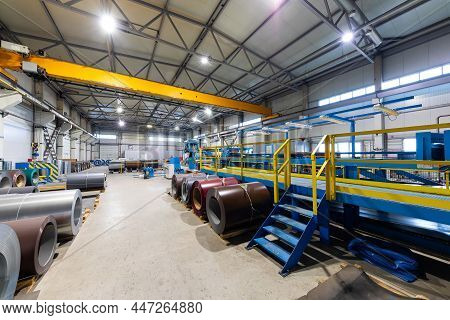 Photo Of Steel Roofing Forming Machine. Industrial Machine For Metal Sheet Roof Coils Cut. Factory A