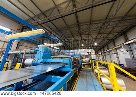Production Line Of Metal Tile For Roof. Steel Forming Machine In Metalwork Factory Workshop. Metal S