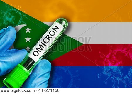 Comoros Outbreak Of Omicron Variant. A Hand In A Blue Rubber Glove Holds A Test Tube With Covid-19 V