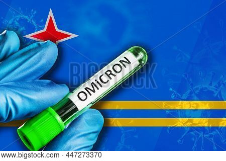 Aruba Outbreak Of Omicron Variant. A Hand In A Blue Rubber Glove Holds A Test Tube With Covid-19 Vir
