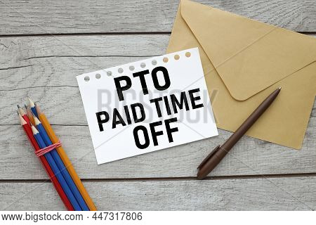 Pto Paid Time Off Sheets Of White Paper Notepad On Wooden Table Near Pen And Envelope