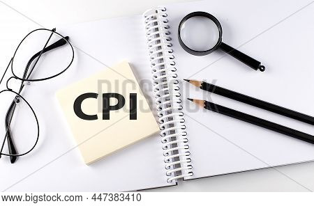 Word Cpi - Consumer Price Index On Sicker On The Notebook With Pencils,magnifier And Glasses