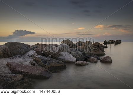 An Old Sea Port Mole Built Of Large Boulders. Latvia City Engure
