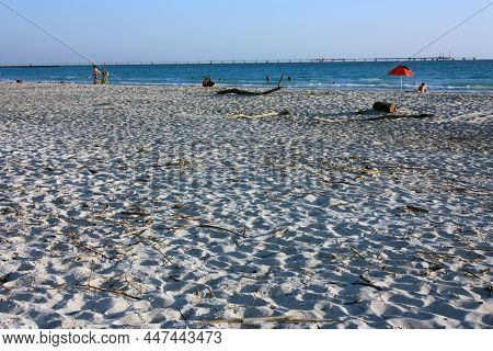 Beautiful White Sandy Beach In The Sunset Lights In Tuscany