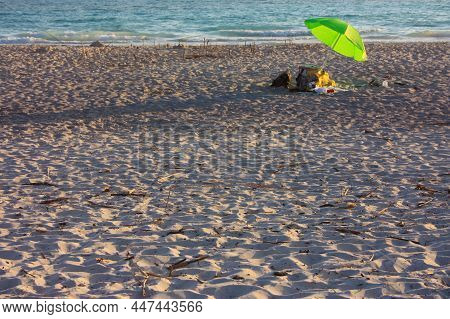 Beautiful White Sandy Beach In The Sunset Lights In Tuscany